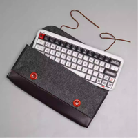 Qube mechanical keyboard storage with rope wrapping and felt leather protective bag.